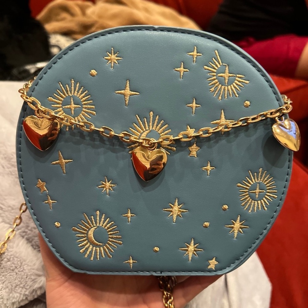 SOLD: Celestial Blue Round Crossbody Bag – Gold Chain & Star/Moon Embroidery